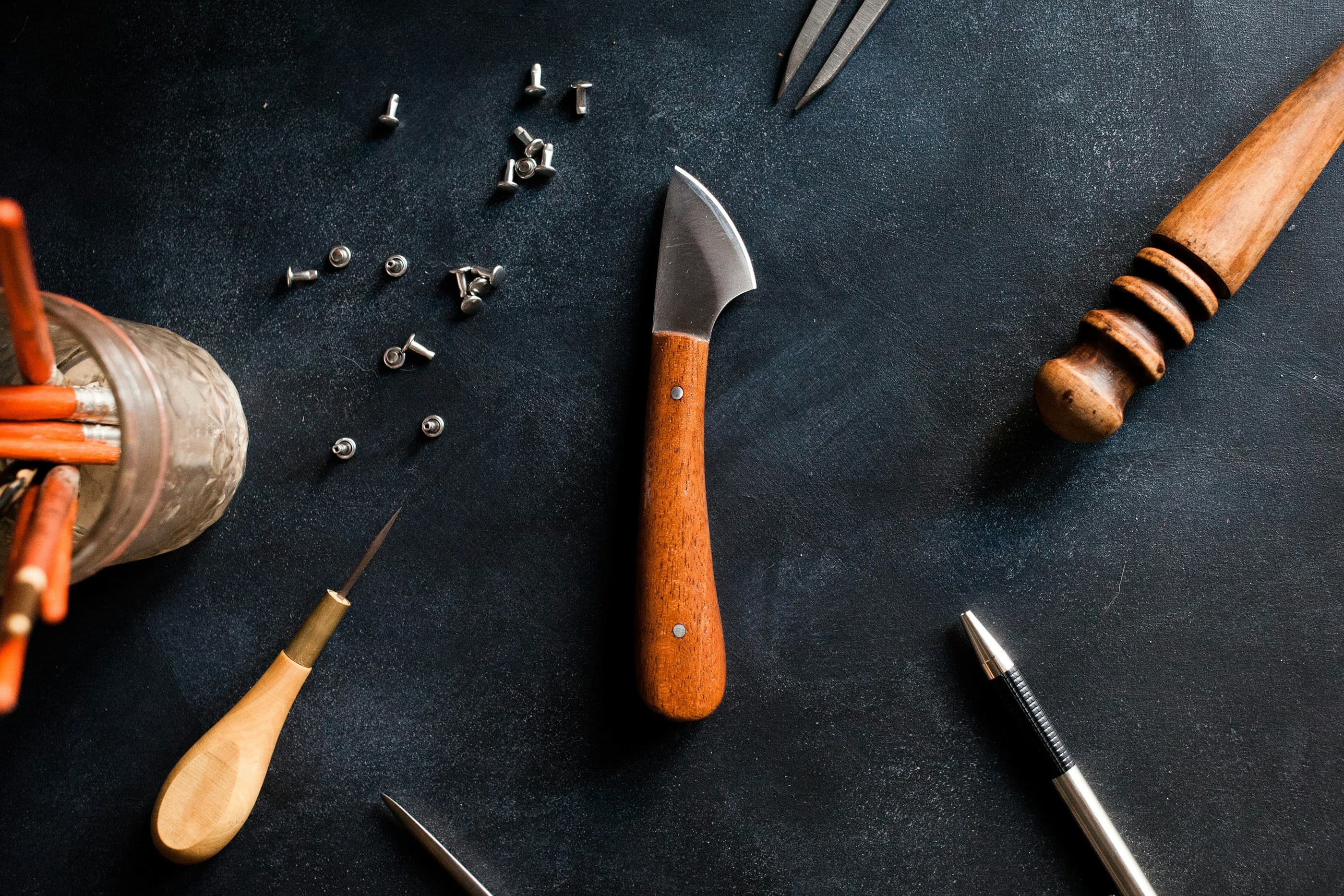 Laser engraving tools and finished leather goods